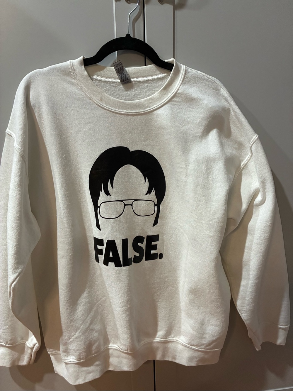 Gildan White Crewneck Sweatshirt with Black Graphic Face and "FALSE." Text